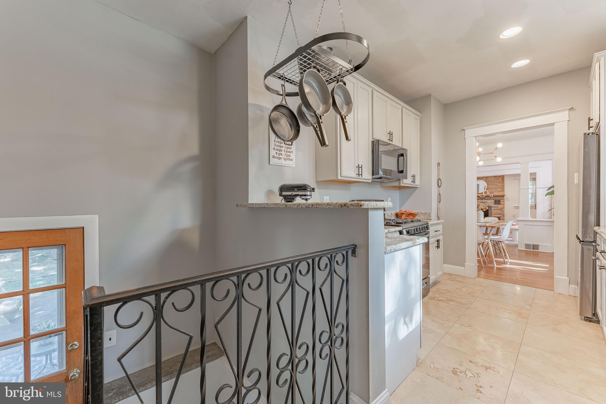 864 North Avenue Springfield, PA 19064 - Photo 24 of 33 a kitchen with stainless steel appliances kitchen island granite countertop a refrigerator and a sink