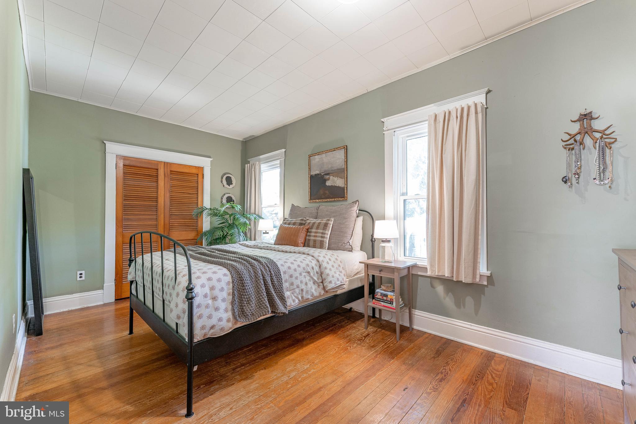 864 North Avenue Springfield, PA 19064 - Photo 25 of 33 a bed sitting in a bedroom next to a window