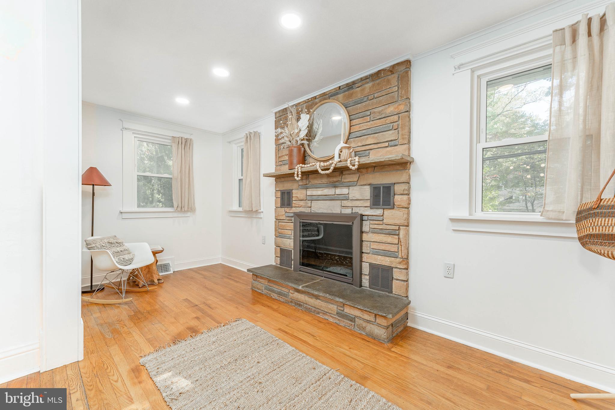 864 North Avenue Springfield, PA 19064 - Photo 7 of 33 a living room with furniture and a fireplace