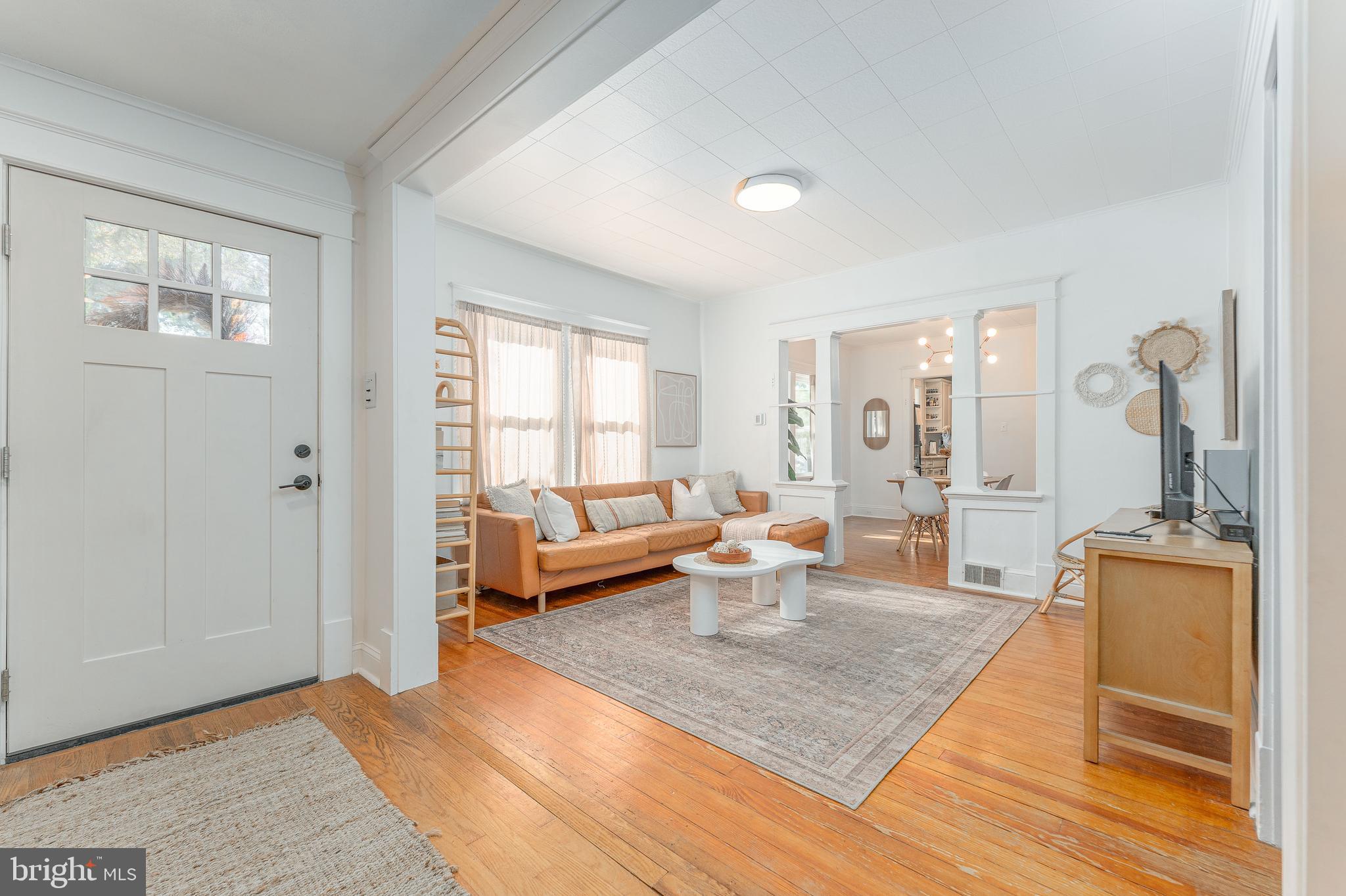 864 North Avenue Springfield, PA 19064 - Photo 8 of 33 a living room with furniture a rug and a window