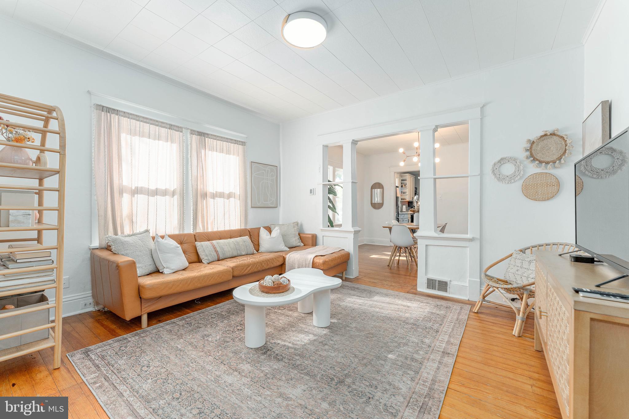 864 North Avenue Springfield, PA 19064 - Photo 9 of 33 a living room with furniture a rug and a large window