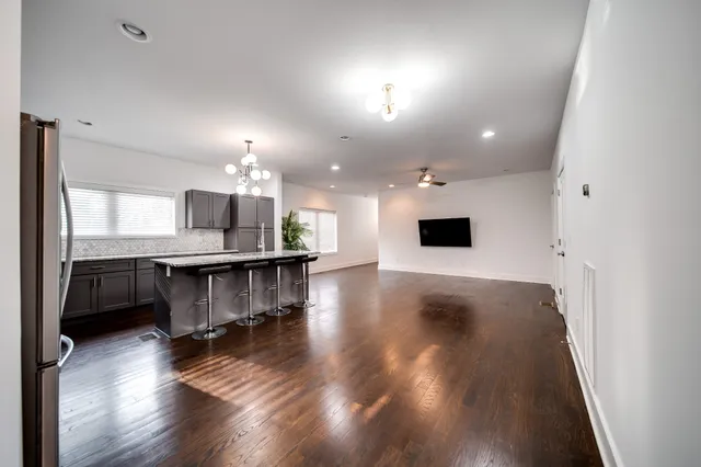 a lobby with furniture and a wooden floor