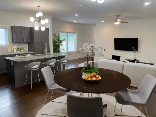 a view of a dining room with furniture and wooden floor