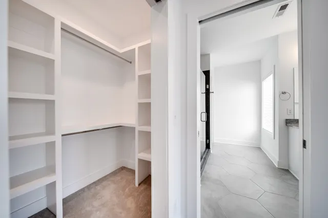 a view of a hallway with closet