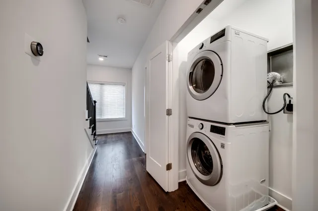 a view of a hallway with washer and dryer
