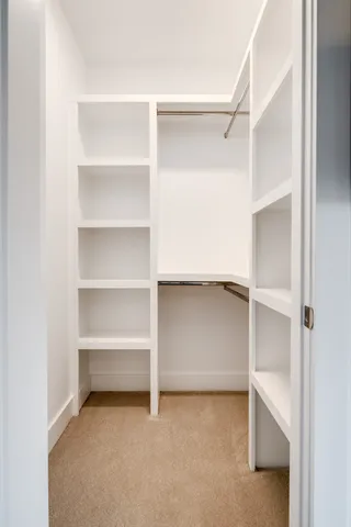 a view of an empty walk in closet