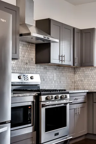 a stove top oven sitting inside of a kitchen