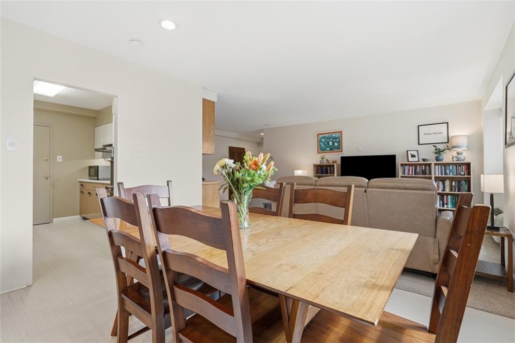 128 North Craig Street, Unit 814 Pittsburgh, PA 15213 - Photo 11 of 34 a view of a dining room with furniture and wooden floor