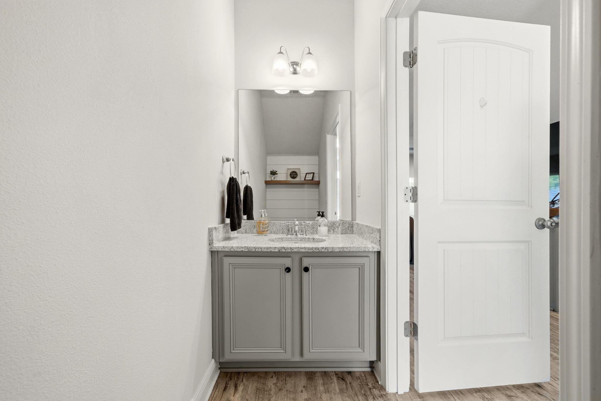 25 Crossing Lane, Unit C Santa Rosa Beach, FL 32459 - Photo 12 of 37 a bathroom with a granite countertop sink and a mirror