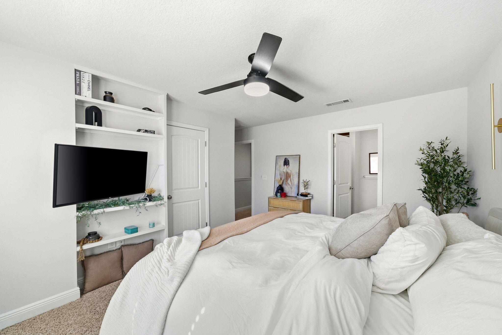 25 Crossing Lane, Unit C Santa Rosa Beach, FL 32459 - Photo 15 of 37 a bedroom with a bed and a flat screen tv