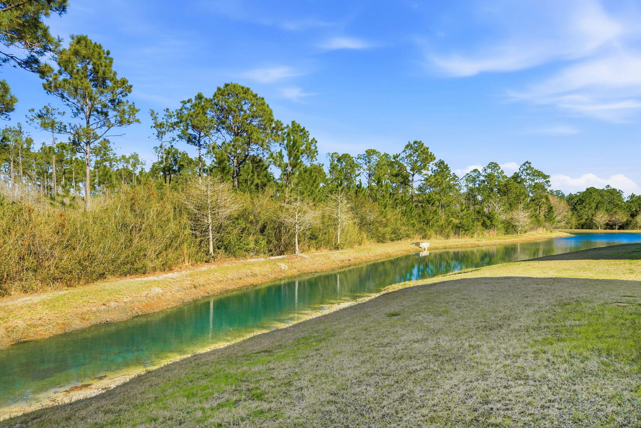 25 Crossing Lane, Unit C Santa Rosa Beach, FL 32459 - Photo 27 of 37 a view of a lake with a yard