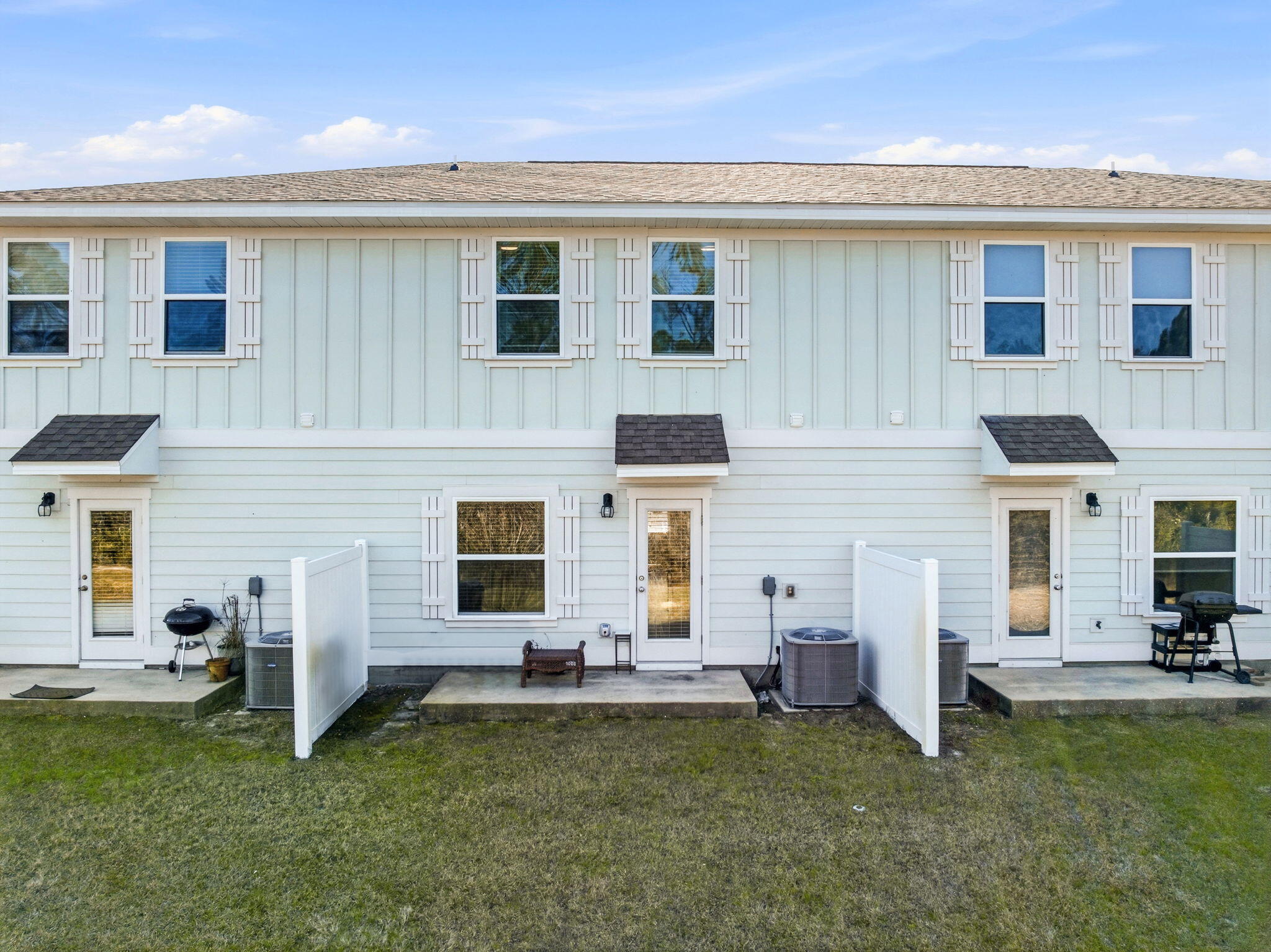 25 Crossing Lane, Unit C Santa Rosa Beach, FL 32459 - Photo 29 of 37 a view of a house with a flat tv screen and a fireplace
