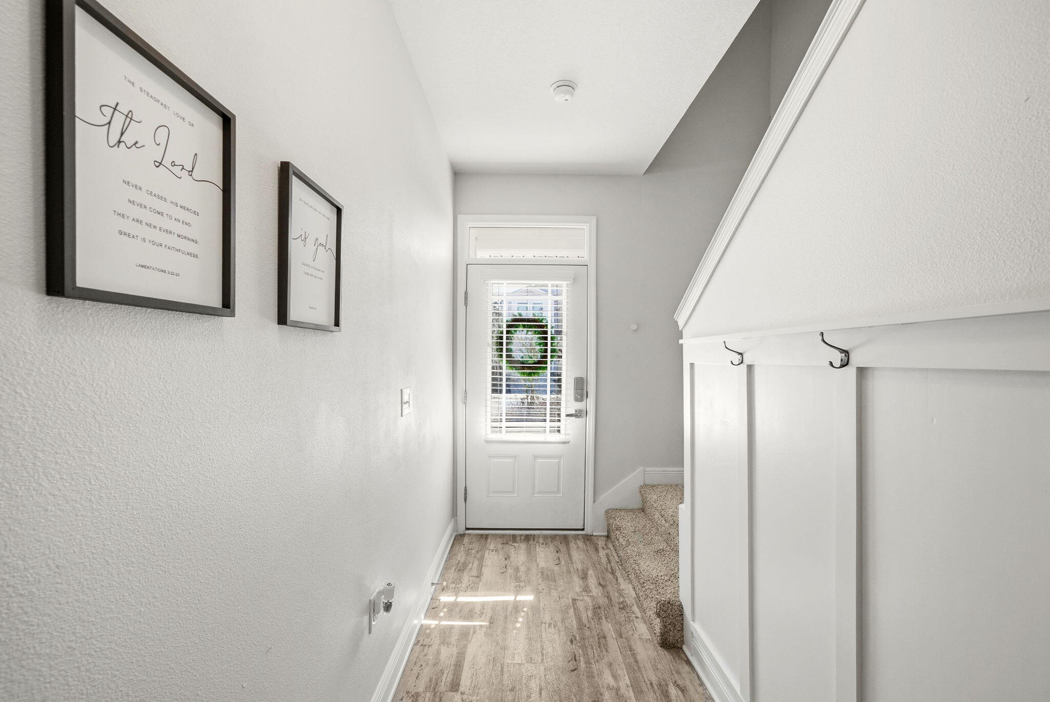 25 Crossing Lane, Unit C Santa Rosa Beach, FL 32459 - Photo 3 of 37 a view of a hallway with wooden floor and closet