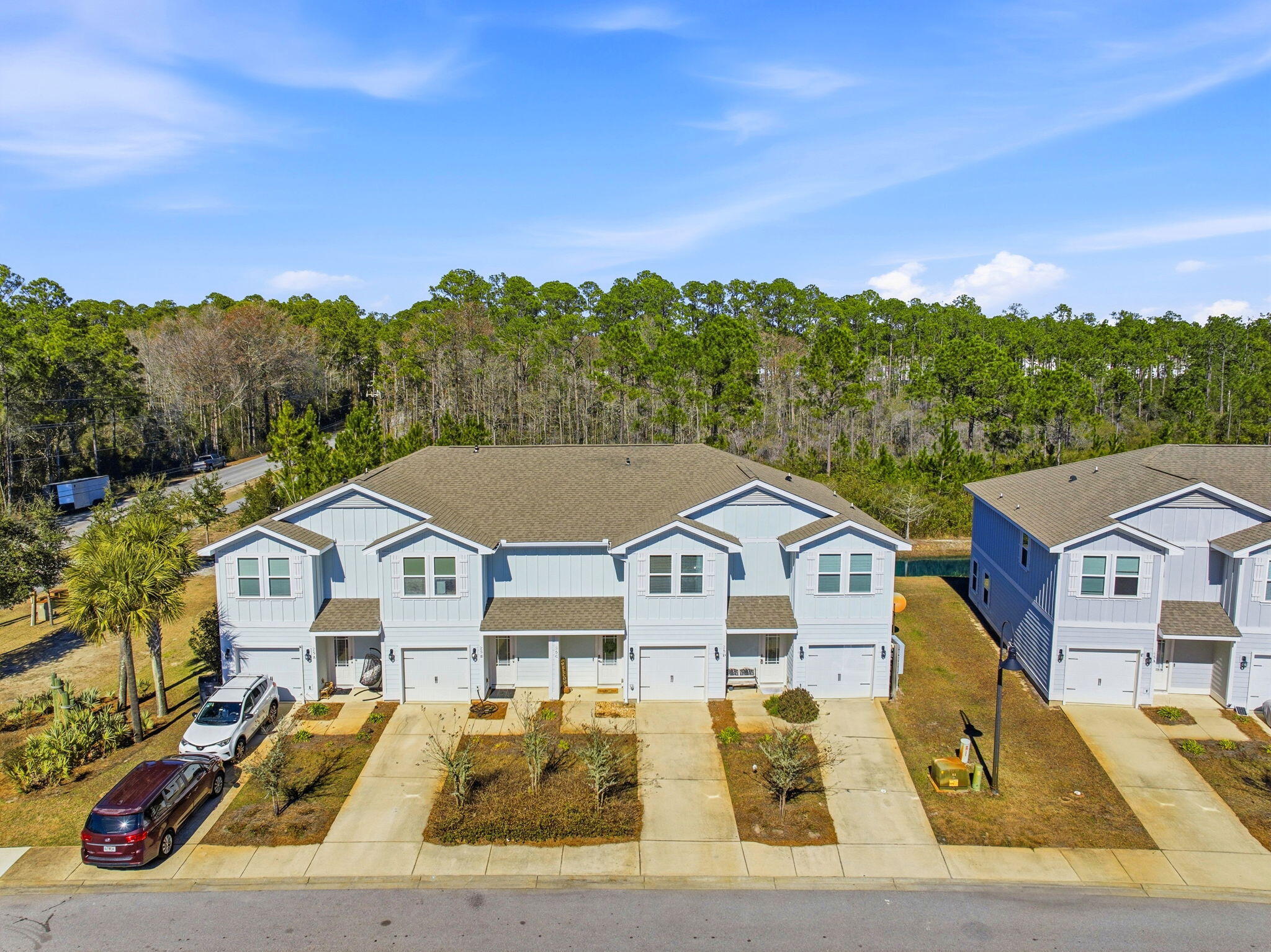25 Crossing Lane, Unit C Santa Rosa Beach, FL 32459 - Photo 30 of 37 a view of house with garden space and car parked
