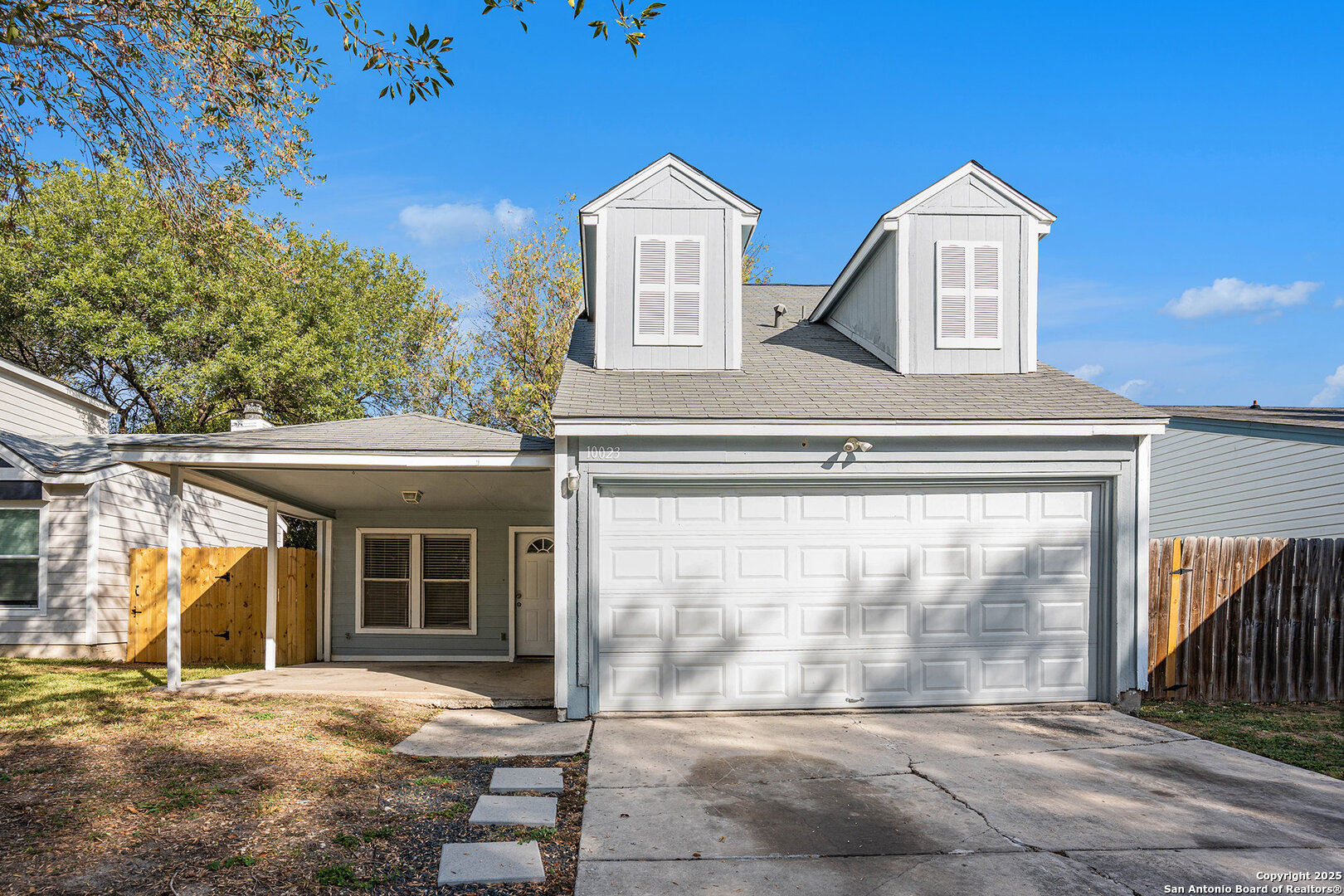 10023 Amber Field Drive San Antonio, TX 78245 - Photo 1 of 28 a front view of a house with a yard