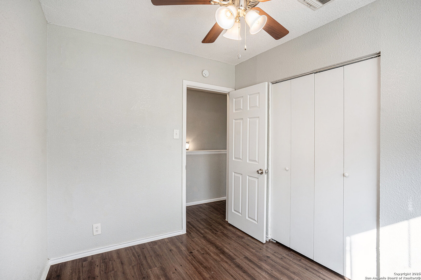 10023 Amber Field Drive San Antonio, TX 78245 - Photo 19 of 28 wooden floor in an empty room with a window