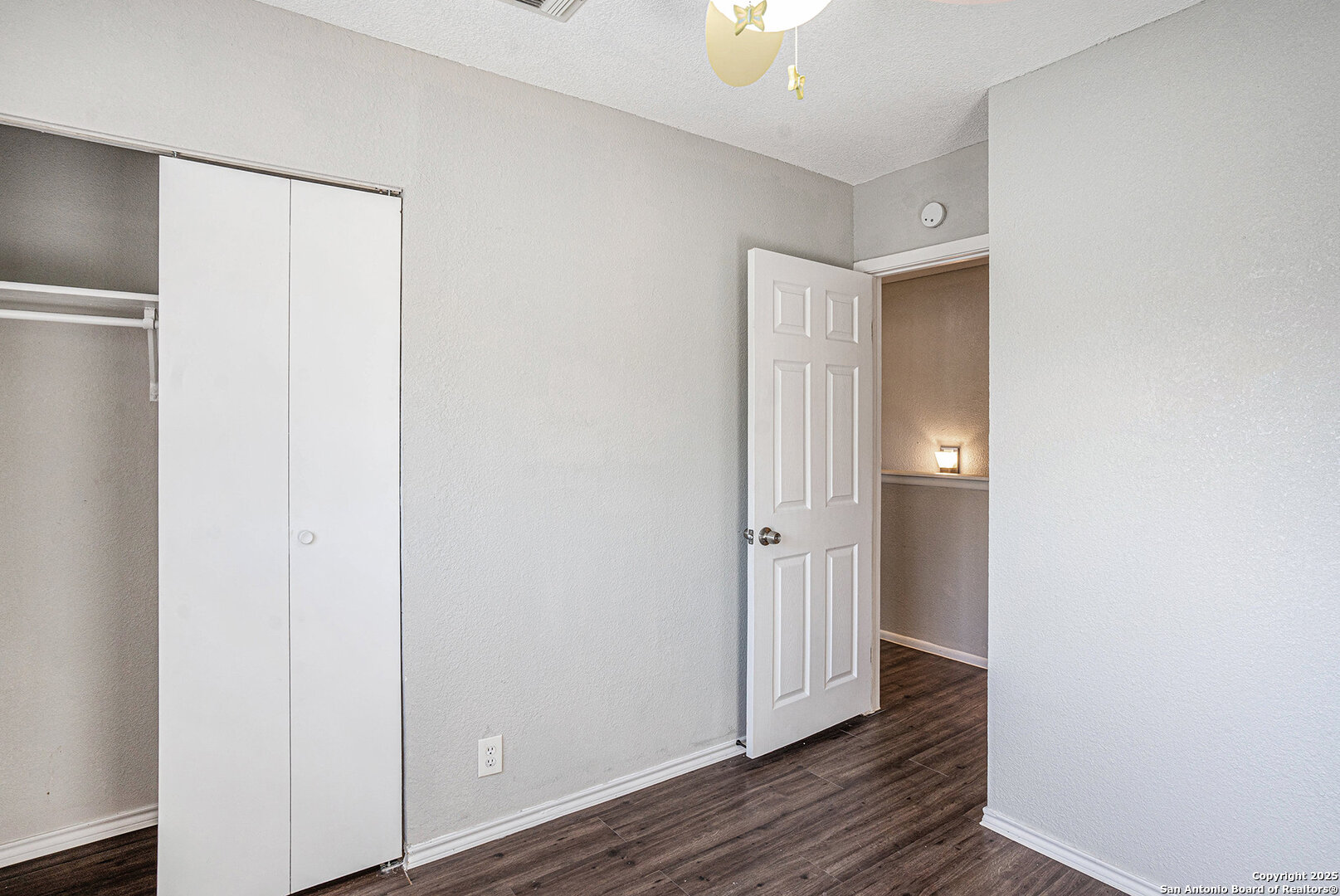 10023 Amber Field Drive San Antonio, TX 78245 - Photo 21 of 28 a view of an empty room with wooden floor