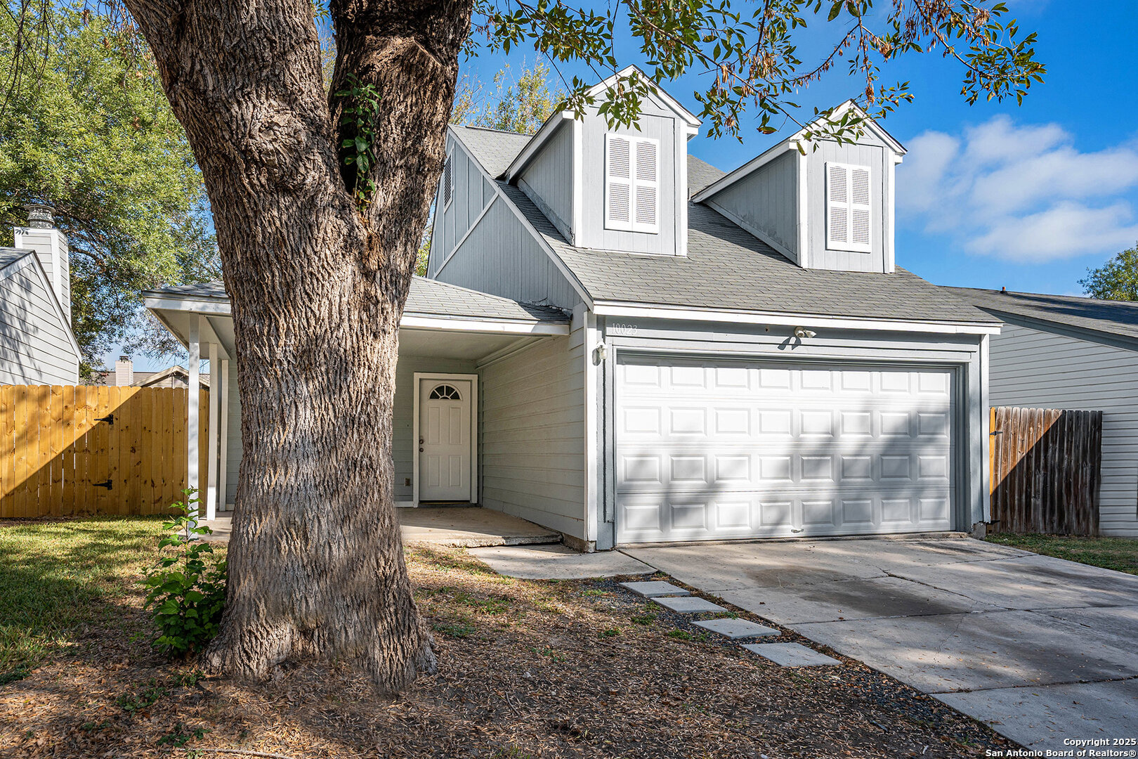 10023 Amber Field Drive San Antonio, TX 78245 - Photo 3 of 28 a front view of a house with a yard and garage