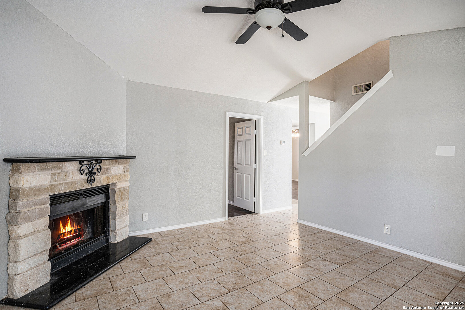10023 Amber Field Drive San Antonio, TX 78245 - Photo 6 of 28 a view of an empty room with windows and fire place