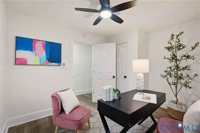 a workspace with furniture and a potted plant