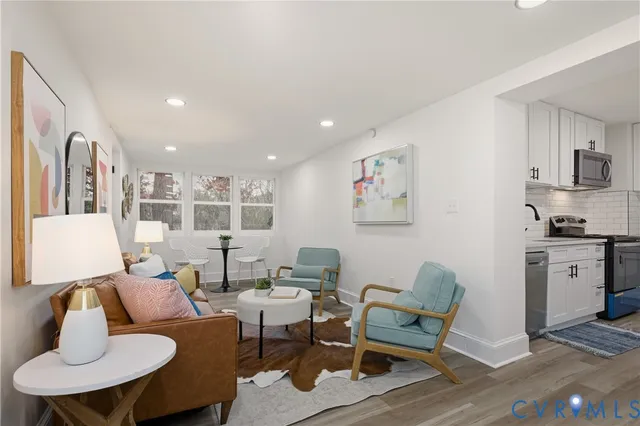 a living room with furniture and a stove
