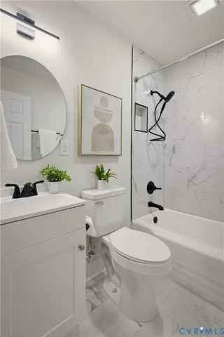 a bathroom with a sink toilet a mirror and shower