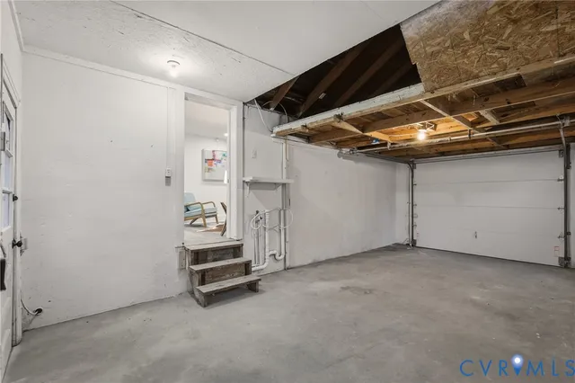 a view of room with air conditioner duct and materials on floor