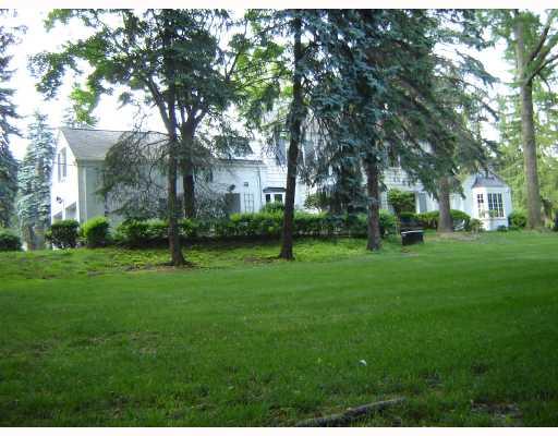 100 Hawthorne Road Fox Chapel, PA 15238 - Photo 15 of 15 Exterior Back. Beautiful old trees give character to the view of the two car garage. The yard is a great place for play.