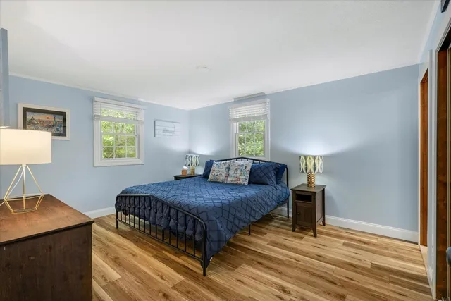 a bedroom with a bed and a desk