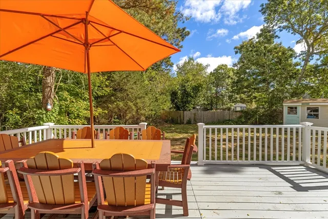 a view of a chairs and table on the deck