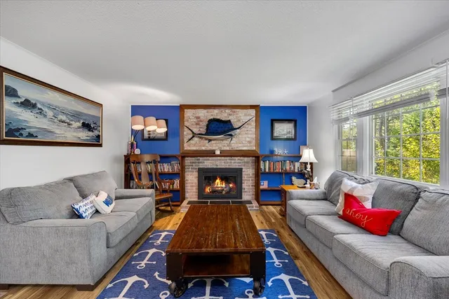 a living room with furniture and a fireplace