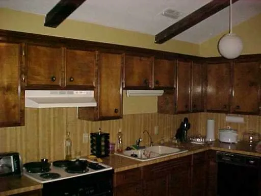 a kitchen with a sink and cabinets