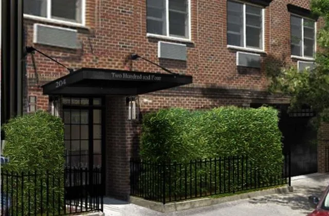 a view of a house with a door and wooden floor