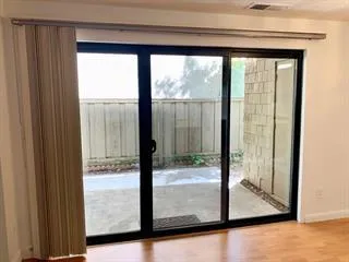 a view of a big room with windows and mountain view