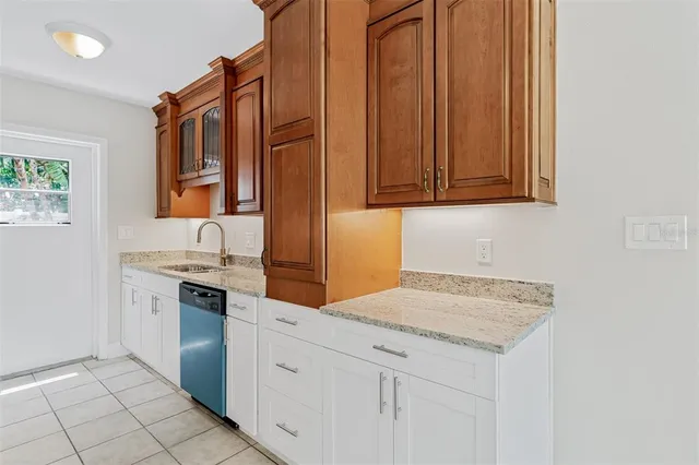 a kitchen with stainless steel appliances granite countertop a sink and cabinets