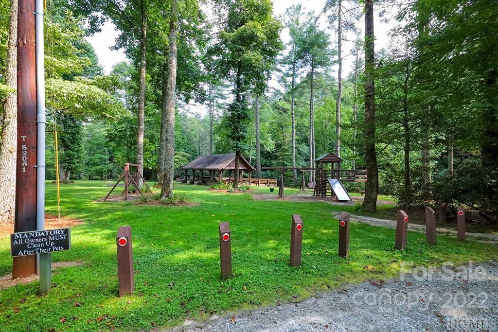 12 Turkey Roost Road, Unit 12 Sapphire, NC 28774 - Photo 3 of 14 a view of a park with plants and large trees