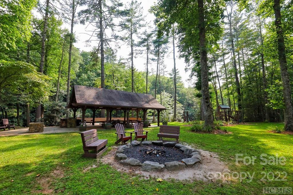 12 Turkey Roost Road, Unit 12 Sapphire, NC 28774 - Photo 4 of 14 a view of a table and chairs in the garden