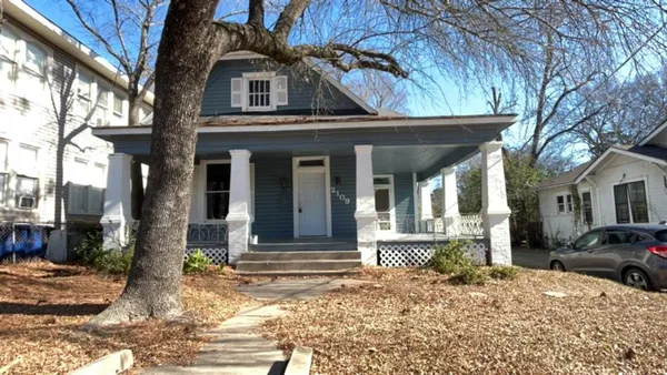 a front view of a house with a porch