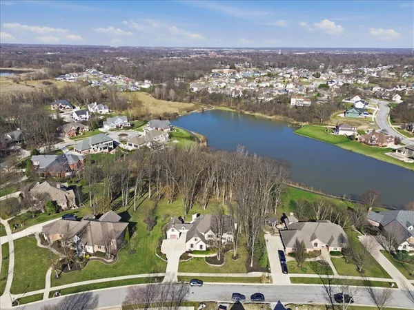 a bedroom with furniture and a large window