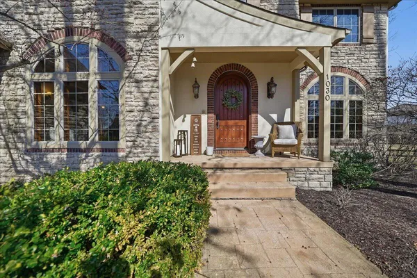 a living room with furniture window and wooden floor