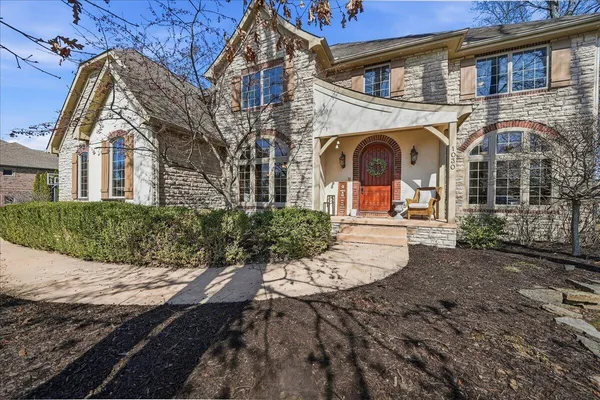 a kitchen with a sink a washer and dryer next to a window