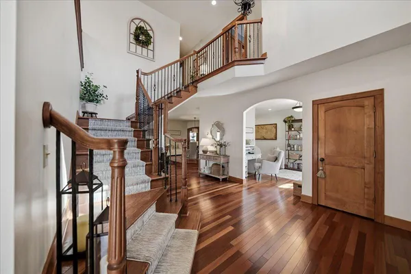 a kitchen with a sink cabinets stainless steel appliances and a window