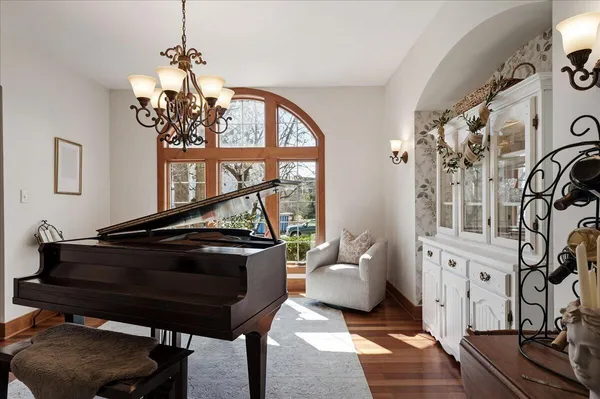 a view of a dining room with furniture wooden floor and a clock