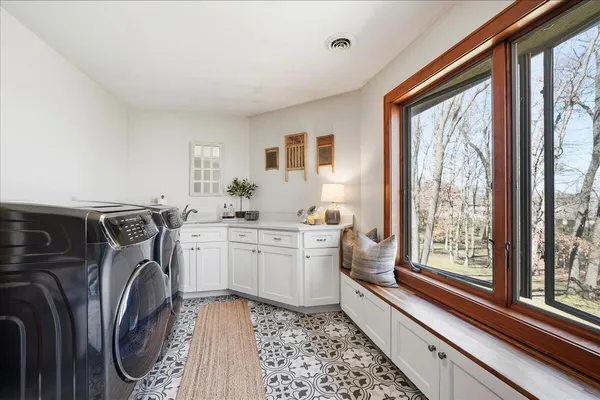 a kitchen with a sink stove and cabinets