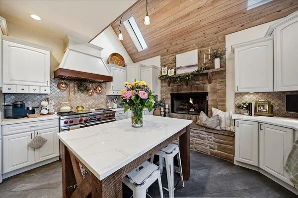 a view of a hallway with wooden floor and windows