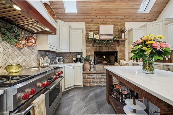 a living room with furniture and a large window with outer view