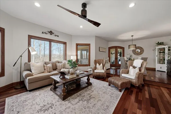 a view of a dining room with furniture and wooden floor