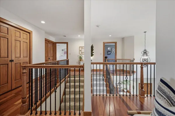 a living room with pool table and windows