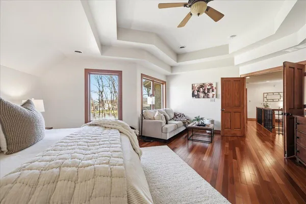 a dining room with furniture a chandelier and a rug