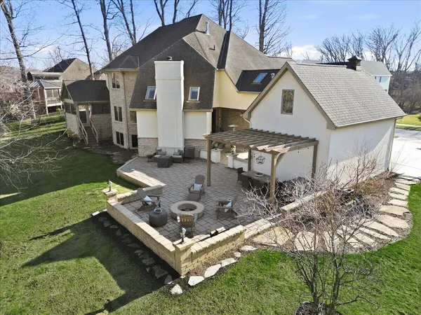 an aerial view of a house with garden space and trees